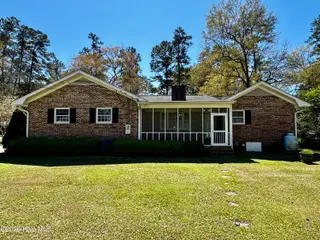 200 Elm Street, Whiteville, NC 28472 — 3-bedroom home, Whiteville, NC, photo 8 of 33: Back of home with screened in porch