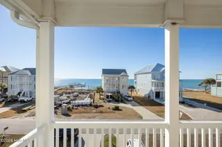 127 Sound Point Drive, Harkers Island, NC 28531 – photo 19: Waterview front Master Bedroom porch