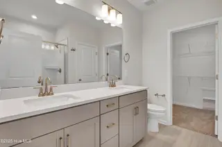 1214 Sunwater Terrace, Leland, NC 28451 — 4-bedroom townhome in Grand Park, Leland, NC, photo 9 of 39: Primary Bathroom