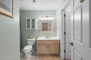 908 Resort Circle Unit 512, Sunset Beach, NC 28468 — 2-bedroom condo in Colony II, Sunset Beach, NC, photo 23 of 39: Primary Bathroom