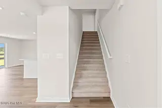 8027 Sterling Oaks Drive NW, Ash, NC 28420 – photo 13: Stair going up