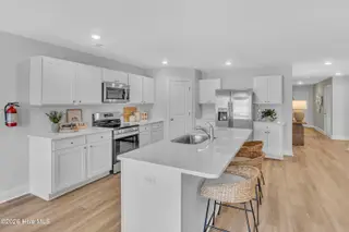 7111 Woodline Drive SW, Sunset Beach, NC 28468 – photo 18: Seaside Palms_Model_Venture_6911 Seaside