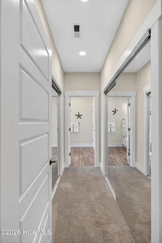 460 Summerhouse Drive, Holly Ridge, NC 28445 – photo 19: primary bedroom closets