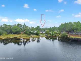 219 N Lake Keziah Drive, Southport, NC 28461 — 3-bedroom home in Boiling Spring Lakes, Southport, NC, photo 3 of 30: Photo 29 lake view with house