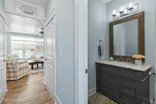 3604 W Pelican Drive, Oak Island, NC 28465 – photo 10: 1st Floor Half Bath