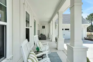 9599 Fallen Pear Lane NE, Leland, NC 28451 – photo 7: Rocking chair front porch