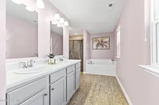733 Avington Lane NE, Leland, NC 28451 – photo 20: Ensuite with Dual Sinks and Soaking Tub