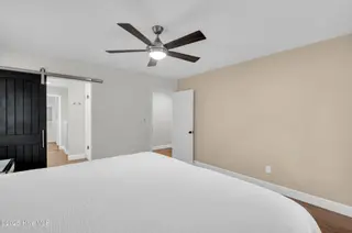 113 Yorkshire Lane, Wilmington, NC 28409 — 3-bedroom home in Lansdowne Estates, Wilmington, NC, photo 18 of 48: Primary with bathroom barn door