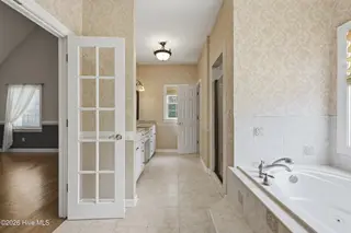 209 Small Drive, Elizabeth City, NC 27909 – photo 21: 209 Small Primary Bath with french doors