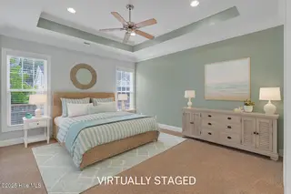 3918 Meeting Place Lane, Southport, NC 28461 — 4-bedroom home in Arbor Creek, Southport, NC, photo 20 of 57: primary bedroom virtually staged