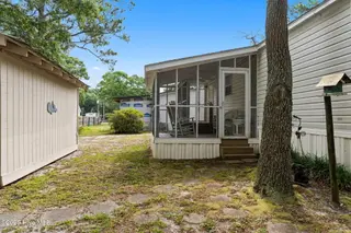 7203 Banner Street SW, Ocean Isle Beach, NC 28469 — 3-bedroom manufactured home in Seaside Heights, Ocean Isle Beach, NC, photo 23 of 38: Back