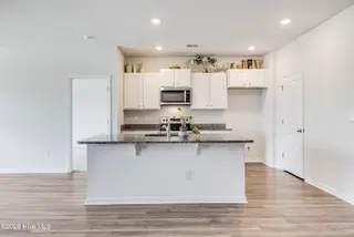 1038 Burled Oak Ridge Loop SE, Bolivia, NC 28422 — 3-bedroom home in Avalon, Bolivia, NC, photo 12 of 64: kitchen island