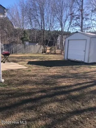 3923 Sabre Lane, Wilson, NC 27896 – photo 5: BACK YARD WITH STORAGE BUILDING