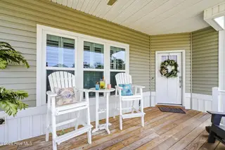 202 NE 64th Street, Oak Island, NC 28465 – photo 5: Smell the ocean air from your porch