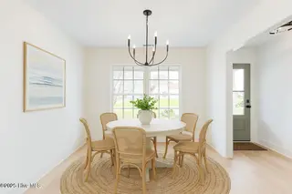 4930 N Hampton Drive SE, Southport, NC 28461 – photo 9: Virtually staged dining room