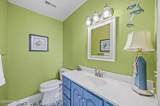 5127 W Beach Drive, Oak Island, NC 28465 – photo 23: 46_bathroom