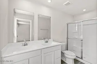 8027 Sterling Oaks Drive NW, Ash, NC 28420 – photo 10: Owner Suite