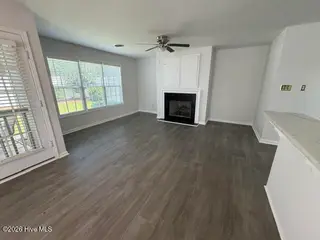4710 Gardenia Circle, Rocky Mount, NC 27804 – photo 7: DINING AREA/LIVING ROOM WITH FIREPLACE