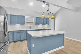 127 NW 19th Street, Oak Island, NC 28465 – photo 5: Kitchen with updated appliances