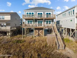 4321 E Beach Drive, Oak Island, NC 28465 – photo 1: 53-web-or-mls-DJI_20251231150938_0613_D