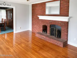 1902 Trent Boulevard, New Bern, NC 28560 – photo 4: Bright living space with brick fireplace