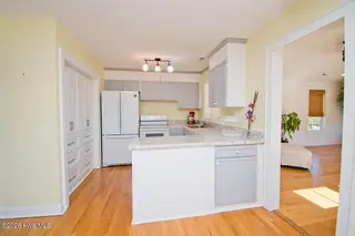 307 Anita Forte Drive, Cape Carteret, NC 28584 – photo 10: Kitchen to sun room