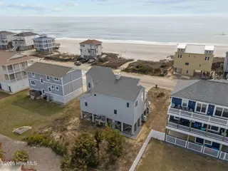 6618 W Beach Drive, Oak Island, NC 28465 – photo 16: 15-web-or-mls-DJI_20260304121859_0418_D