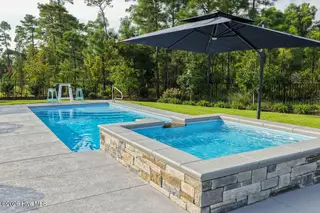 3211 Oceanic Bay Drive, Southport, NC 28461 — 4-bedroom home in St James, Southport, NC, photo 4 of 38: Pool and Spa