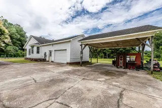 127 Rodney Lanier Road, Chinquapin, NC 28521 — 3-bedroom home, Chinquapin, NC, photo 2 of 61: Side 1 car garage and carport