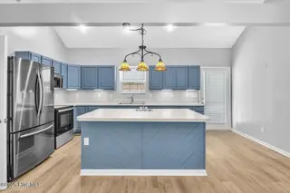 127 NW 19th Street, Oak Island, NC 28465 – photo 6: Kitchen with updated appliances