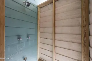 9936 Louise Howard Court East, Emerald Isle, NC 28594 — 3-bedroom townhome in Spinnakers Reach, Emerald Isle, NC, photo 15 of 32: Ground Floor Outdoor Shower