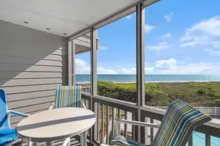 2111 W Ft Macon Road 248 Dunescape, Atlantic Beach, NC 28512 – photo 5: Screened porch off of living room