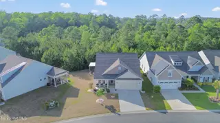 587 Meadowbrook Lane NW, Calabash, NC 28467 – photo 2: Backs to Trees