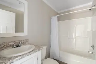6777 Lewis Drive SE, Winnabow, NC 28479 – photo 20: Guest bathroom