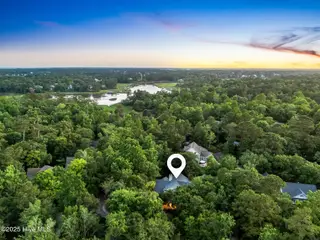 6932 Runningbrook Terrace, Wilmington, NC 28411 — 5-bedroom home in Demarest Landing, Wilmington, NC, photo 14 of 53: Aerial Sunset with Water