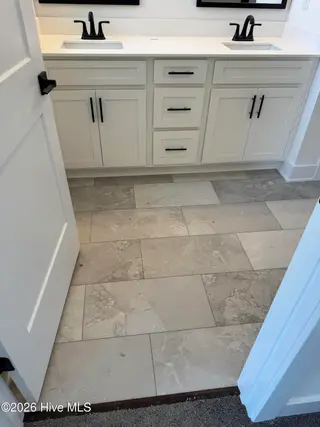 23 Joyner Park Drive, Rocky Mount, NC 27803 – photo 10: dual vanity sink in primary bathroom