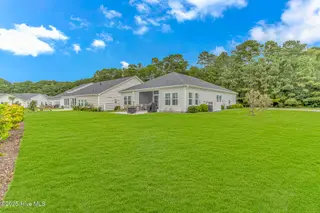 8960 Smithfield Drive NW, Calabash, NC 28467 – photo 3: Back and side yard