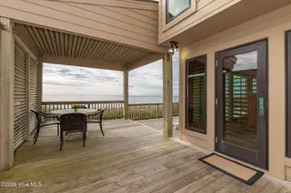 111 Dogwood Circle, Pine Knoll Shores, NC 28512 – photo 23: Patio with entrance to living room