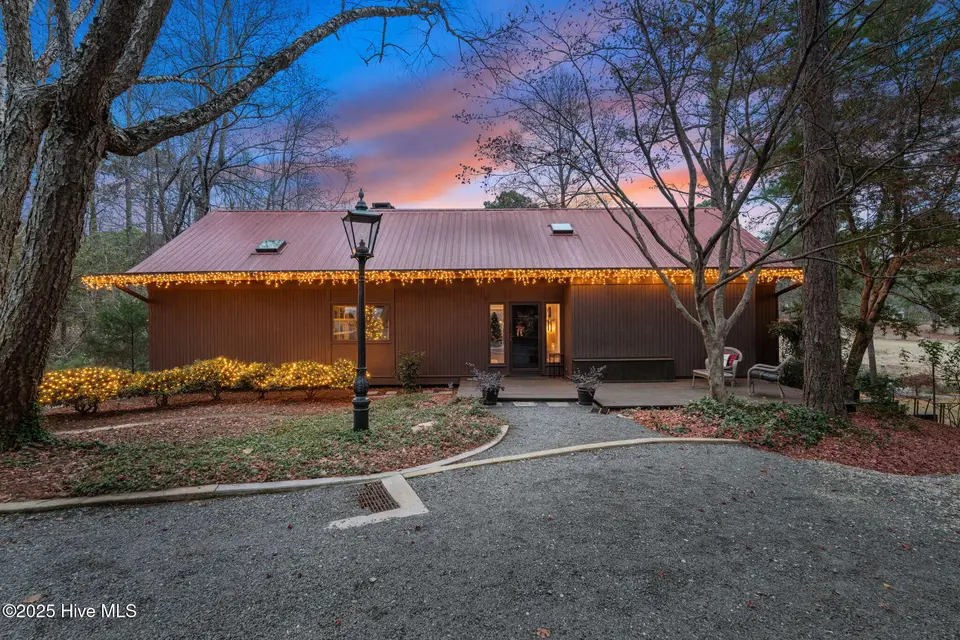 31 Cardinal Drive, Whispering Pines, NC 28327 – photo 1 of 53: Front Elevation at Sunset
