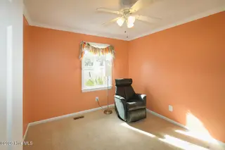 802 E Oak Island Drive, Oak Island, NC 28465 – photo 24: Bedroom 3-024-017-1500x1000