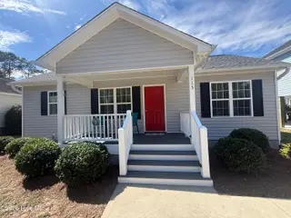 115 NW 17th Street, Oak Island, NC 28465 — 2-bedroom home in Pinners Point, Oak Island, NC, photo 2 of 7: Front