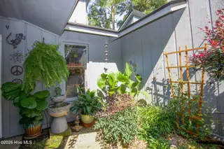 171 Cranes Cove, Vass, NC 28394 – photo 9: 05_Courtyard-Corner-Birdbath_171-Cranes-