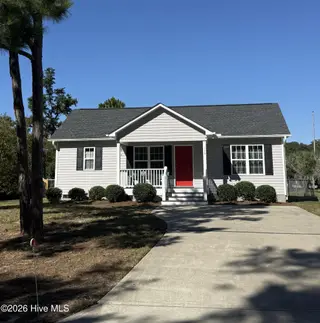 115 NW 17th Street, Oak Island, NC 28465 — 2-bedroom home in Pinners Point, Oak Island, NC, photo 1 of 7: House from Street 1000