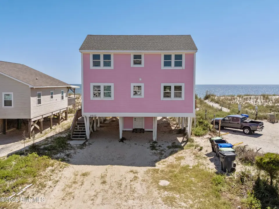 601 E Beach Drive, Oak Island, NC 28465 – photo 1 of 44: 1-web-or-mls-DJI_20250903145101_0384_D