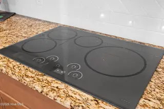 2585 Parkridge Drive, Southport, NC 28461 — 4-bedroom home in St James, Southport, NC, photo 20 of 77: Induction Cook Top is Awesome