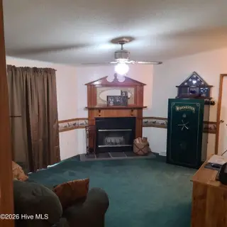 107 Eagle Ridge Drive, Dudley, NC 28333 — 4-bedroom manufactured home in Eagle Ridge, Dudley, NC, photo 9 of 17: Den