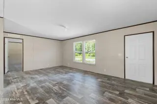 490 Orchard Lane SE, Bolivia, NC 28422 — 3-bedroom manufactured home in Vineyard Plantation, Bolivia, NC, photo 7 of 27: Living room