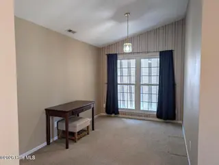 6641 Shire Lane, Wilmington, NC 28411 – photo 15: sitting room in mst bdr