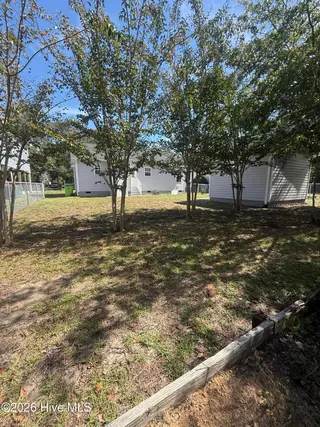 115 NW 17th Street, Oak Island, NC 28465 — 2-bedroom home in Pinners Point, Oak Island, NC, photo 4 of 7: Rear Yard