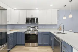 331 Salter Path Road 104 Beachwalk, Pine Knoll Shores, NC 28512 – photo 3: Updated kitchen w/ bar seating